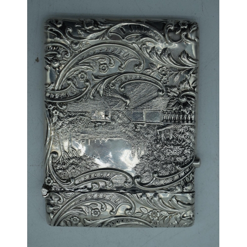 1172 - AN ANTIQUE SILVER REPOUSSE CARD CASE. Birmingham 1899. 73.5 grams. 10 cm x 7.5 cm.