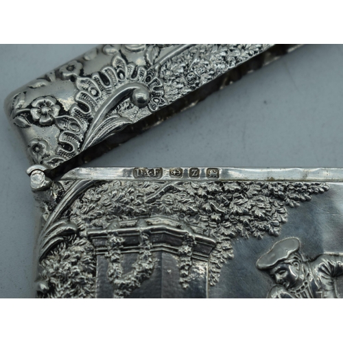 1172 - AN ANTIQUE SILVER REPOUSSE CARD CASE. Birmingham 1899. 73.5 grams. 10 cm x 7.5 cm.