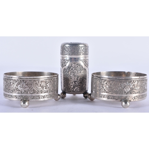 1187 - A PAIR OF 19TH CENTURY ISLAMIC SILVER SALTS and another. 117 grams. Largest 5.5 cm x 3 cm. (3)