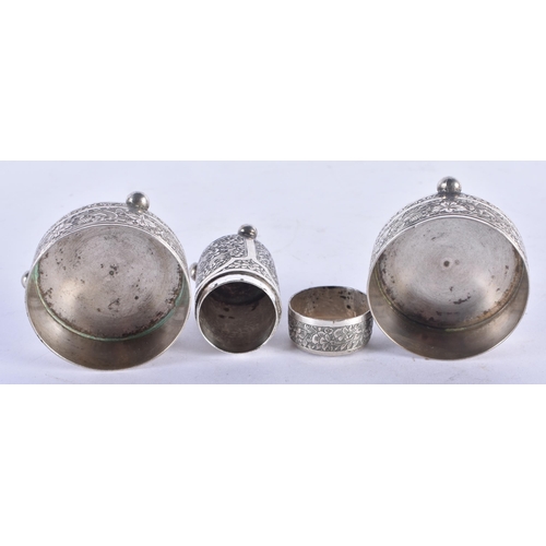 1187 - A PAIR OF 19TH CENTURY ISLAMIC SILVER SALTS and another. 117 grams. Largest 5.5 cm x 3 cm. (3)