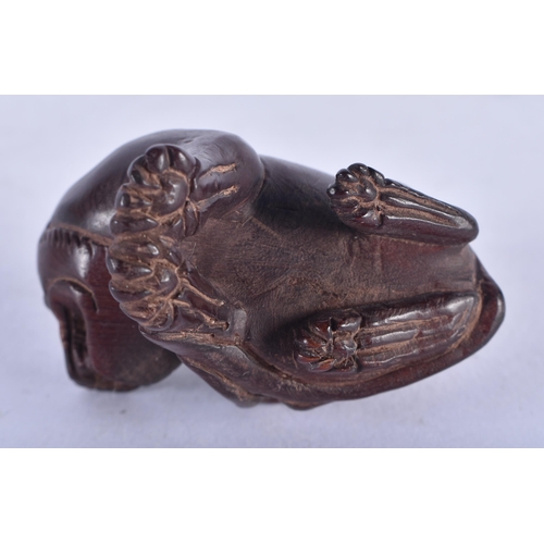 1272 - A Japanese Hardwood Netsuke carved as a dog with a Pup on its back.  4cm x 4cm