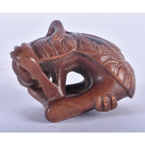 1280 - A Japanese Hardwood Netsuke carved as a Monkey.  6.2 cm x 4.5 cm x 3.6 cm, weight 36.6g