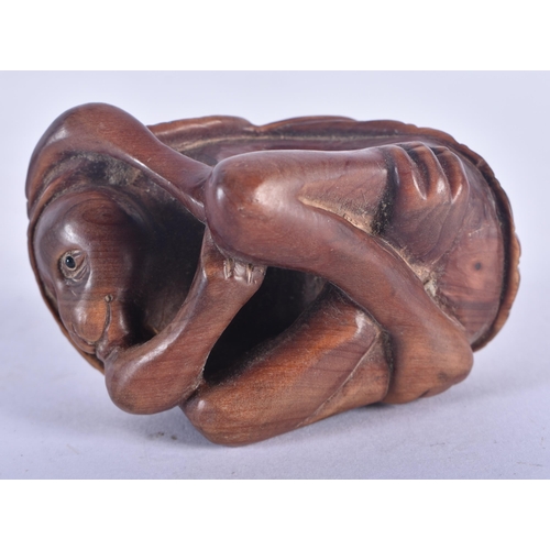 1280 - A Japanese Hardwood Netsuke carved as a Monkey.  6.2 cm x 4.5 cm x 3.6 cm, weight 36.6g