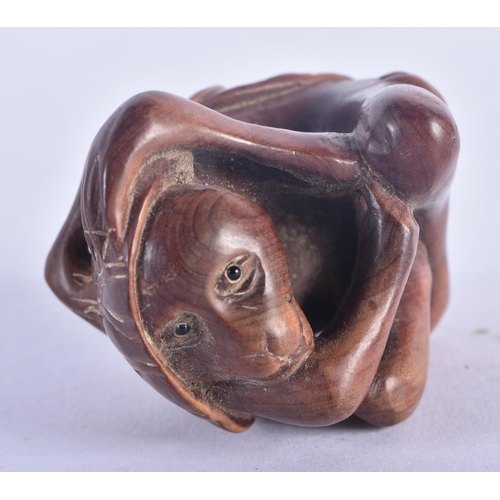 1280 - A Japanese Hardwood Netsuke carved as a Monkey.  6.2 cm x 4.5 cm x 3.6 cm, weight 36.6g