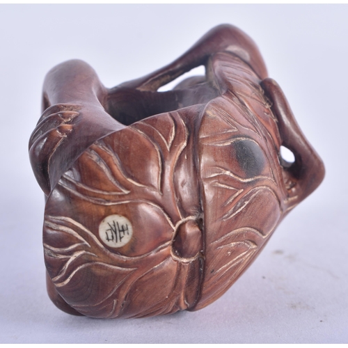 1280 - A Japanese Hardwood Netsuke carved as a Monkey.  6.2 cm x 4.5 cm x 3.6 cm, weight 36.6g