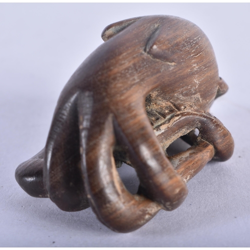 1283 - A Japanese Hardwood Netsuke carved as an Octopus.  5 cm x 3.2 cm x 2.9cm, weight 19.6g