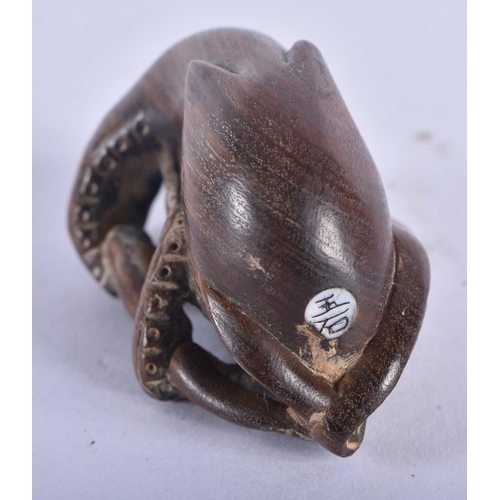 1283 - A Japanese Hardwood Netsuke carved as an Octopus.  5 cm x 3.2 cm x 2.9cm, weight 19.6g