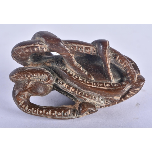 1283 - A Japanese Hardwood Netsuke carved as an Octopus.  5 cm x 3.2 cm x 2.9cm, weight 19.6g