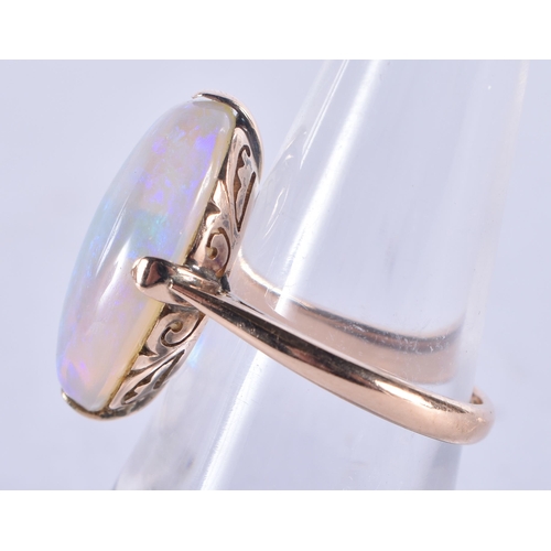 1313 - A 14 Carat and White Opal Ring.  Size N, Stamped 14CT, Opal 18.9mm x 12.9mm x 5.9mm