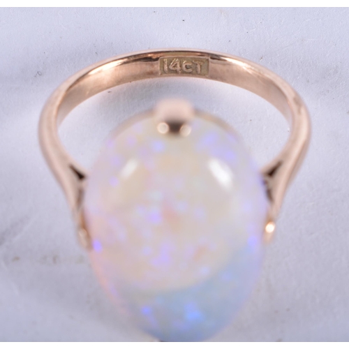 1313 - A 14 Carat and White Opal Ring.  Size N, Stamped 14CT, Opal 18.9mm x 12.9mm x 5.9mm