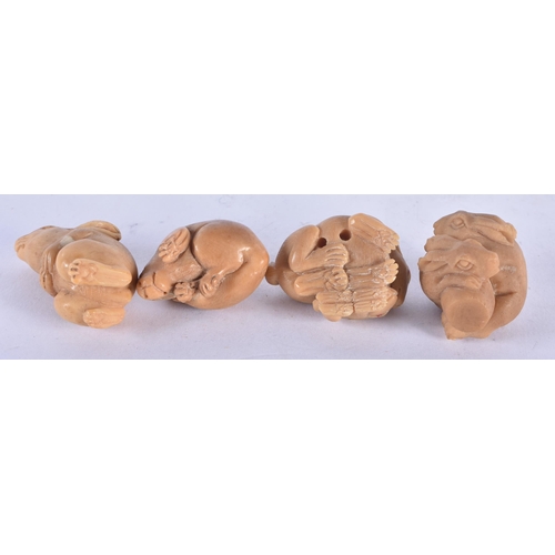 1317 - Four Nut Netsukes carved as Rabbits in various poses.  Largest 3.2 cm x 2.3 cm x 2.1cm, total weight... 