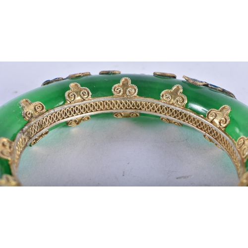 1319 - A Chinese Jade Bangle with Enamel Decoration.  Internal diameter 5.6 cm, weight 107.8g