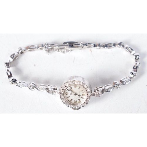 1367 - A 14 Carat White Gold Ladies Cocktail Watch set with diamonds.  Stamped 14K.  Length 16cm, Dial 1.7c... 