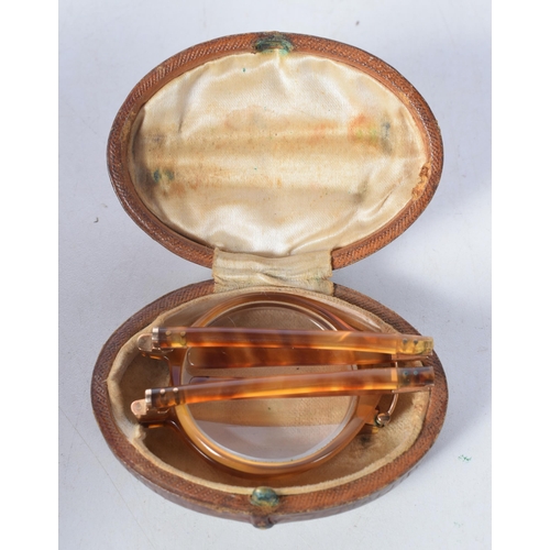 1386 - A Cased Pair of Antique Folding Spectacles with Tortoiseshell Rims and Yellow Metal Fittings.  12.5 ... 