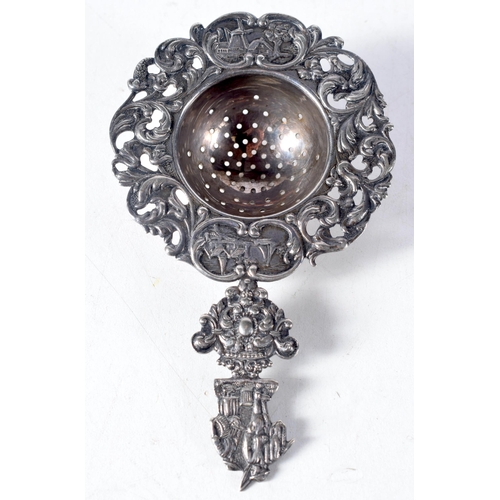 1399 - A Dutch Silver Tea Strainer with ornate decoration.  12.5 cm x 7.5 cm, weight 41g