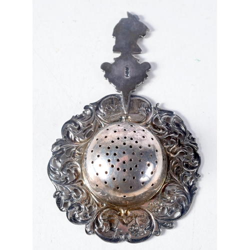 1399 - A Dutch Silver Tea Strainer with ornate decoration.  12.5 cm x 7.5 cm, weight 41g