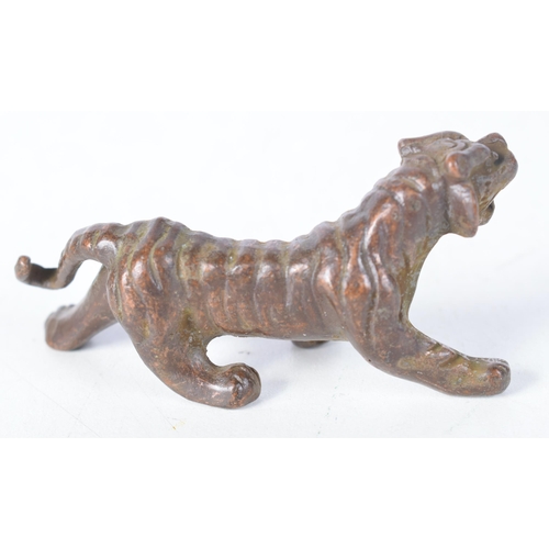 1411 - A Japanese Bronze Tiger.  7.3 cm x 3.4cm x 2.6 cm, weight 94g