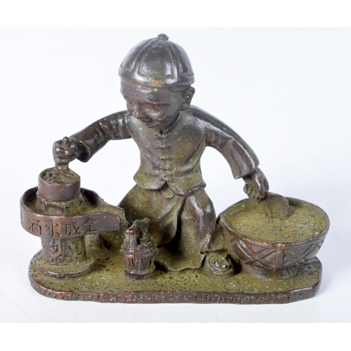 1413 - A Japanese Bronze of a Seated Boy Cooking.  7.5 cm x 5.9cm x 3.3 cm, weight 211g