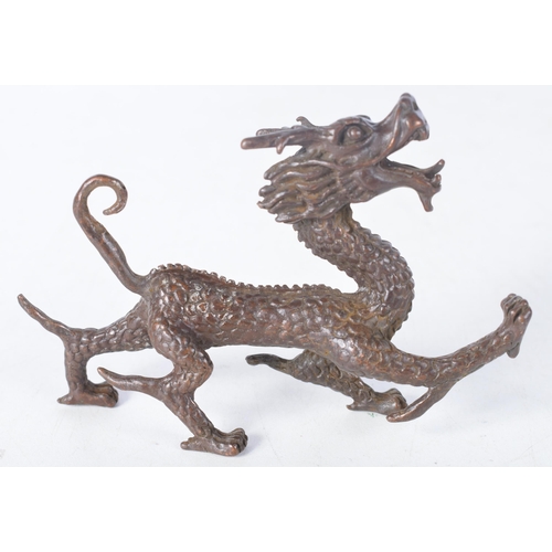 1414 - A Japanese Bronze Dragon.  10.7cm x 7.1cm x 2.2 cm, weight 158.6g