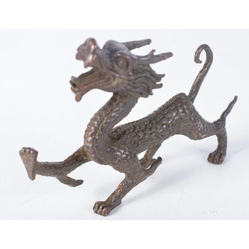 1414 - A Japanese Bronze Dragon.  10.7cm x 7.1cm x 2.2 cm, weight 158.6g