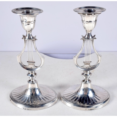 1415 - A Pair of Victorian Silver Lyre Candlesticks (with weighted bottoms)  by Hawksworth, Eyre & Co Ltd. ... 