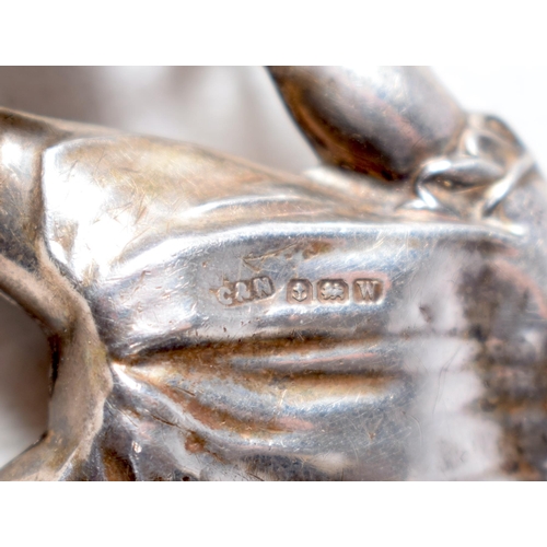 1424 - A Vintage Silver Babies Rattle Pendant in the form of a Baby holding Two Bells by Chrisford & Norris... 