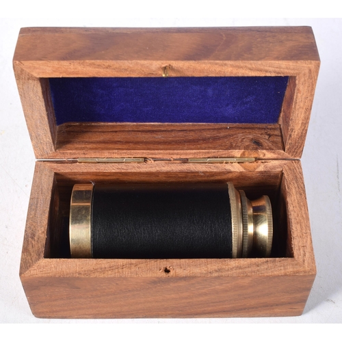 1440 - A Boxed Three Drawer Brass Telescope  15cm (fully extended), 7cm (retracted)