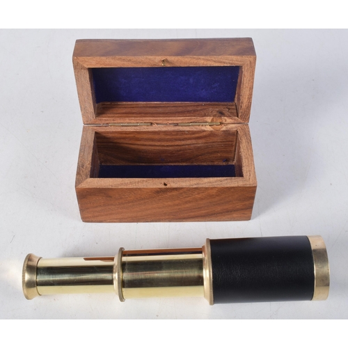 1440 - A Boxed Three Drawer Brass Telescope  15cm (fully extended), 7cm (retracted)