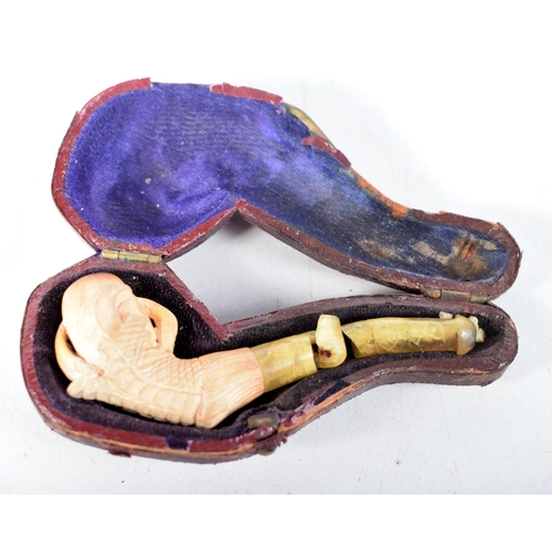 1445 - An Antique Cased Meerschaum Pipe, Bowl carved as a Claw with damaged Stem.  Case 8.5 cm x 3.6 cm