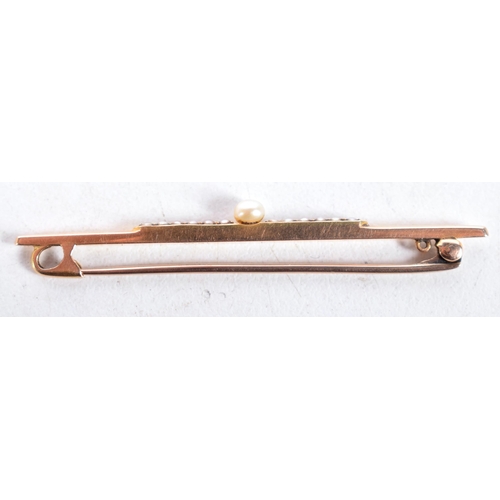 1448 - An Edwardian 15 Carat Gold Bar Brooch set with Pearls.  Stamped 15CT, 5.5 cm x 0.3 cm, weight 3.5g