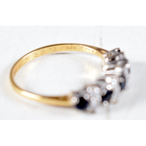 1469 - An 18 Carat Gold Ring set with Diamonds and Sapphires.  Stamped 750, Size N, weight 2.4g