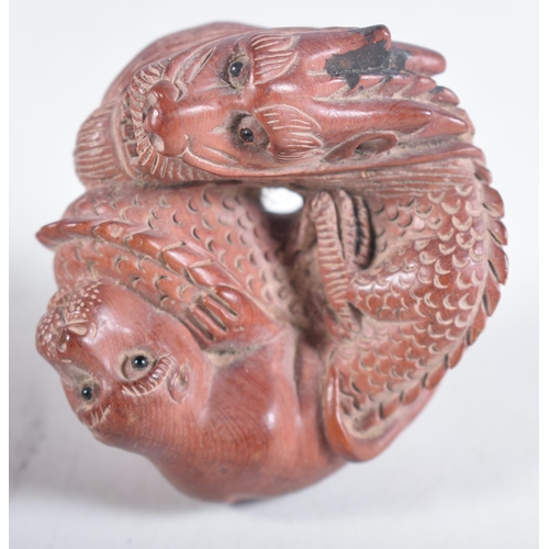 1474 - A Carved Hardwood Dragon Netsuke.  3.1cm x 6 cm x 5.2 cm, weight 38.6g