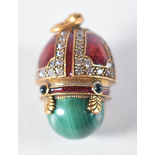 1476 - A Continental Silver Gilt, Enamel and Malachite Egg Pendant.  Stamped 84, 2.6 cm x 1.7cm, weight 10.... 