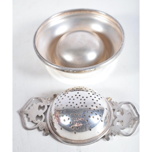 1481 - A Vintage Silver Tea Strainer on Stand by Lanson Ltd.  Hallmarked Birmingham 1959.  3 cm x 10.5 cm x... 