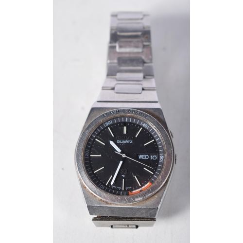 1500 - Seiko Alarm Quartz with Black Dial.  3.5 cm incl crown, needs battery