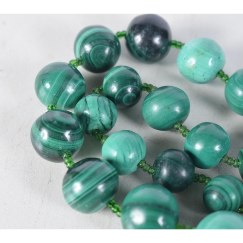 1512 - A Malachite Bead Necklace.  Length 69cm, largest bead 19mm, weight 221g