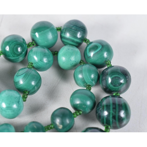 1512 - A Malachite Bead Necklace.  Length 69cm, largest bead 19mm, weight 221g