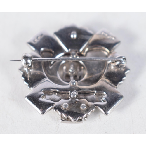 1513 - White gold star of the Order of the Thistle set with 36 rose cut diamonds centered on a Light Infant... 