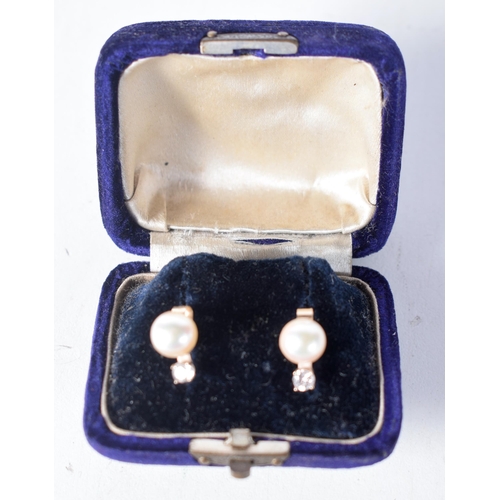 1566 - A Cased Pair of Diamond and Pearl Earrings.  1.1cm x 0.7cm, weight 2.1g