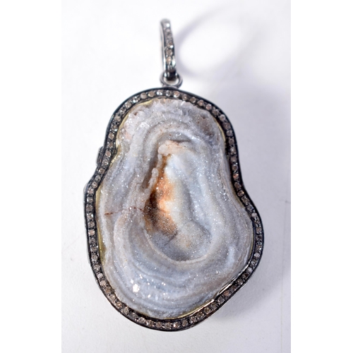 1570 - A Stone Pendant with Diamond Surround.  6.8 cm x 3.7cm, weight 24g