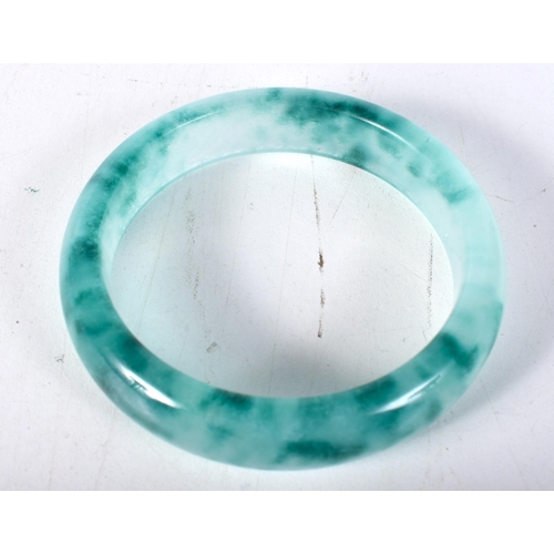 1572 - A Two Tone Green Jade Bangle.  5.9cm internal diameter, weight 57.2g