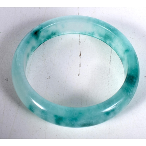 1572 - A Two Tone Green Jade Bangle.  5.9cm internal diameter, weight 57.2g