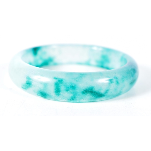 1572 - A Two Tone Green Jade Bangle.  5.9cm internal diameter, weight 57.2g