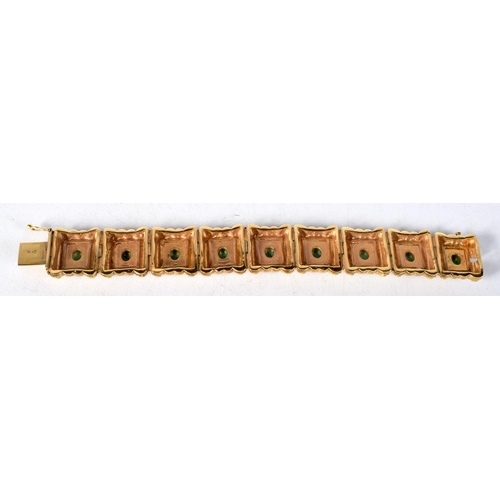 1578 - A 14 Carat Gold Panel Bracelet set with Jade Cabochons.  Stamped 14K, 16.5 cm x 2.1cm, weight 60.4g