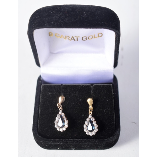 1595 - A Cased Pair of Sapphire and Diamond Earrings.  2.1cm x 0.8 cm, weight 0.8g