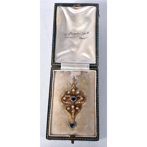 1596 - An Antique Gold (poss 15 Carat) Edwardian Pendant set with Pearls and Sapphires in a fitted case.  5... 