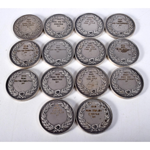 1599 - Fourteen Silver Swimming Medals.  Stamped Sterling.  3.2 cm diameter, total weight 273.5g (14)