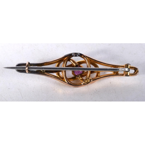 1609 - A 9 Carat Gold Bar Brooch set with an Amethyst.  Stamped 9CT.  4.4cm x 1.2 cm, weight 2.3g