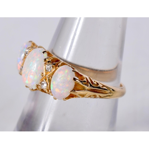 1610 - An 18 Carat Gold and Three Stone Opal Ring set with Diamonds... Stamped 18CT, Size N, weight 4.3g