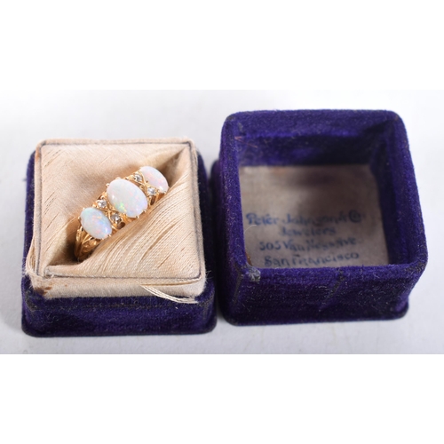 1610 - An 18 Carat Gold and Three Stone Opal Ring set with Diamonds... Stamped 18CT, Size N, weight 4.3g